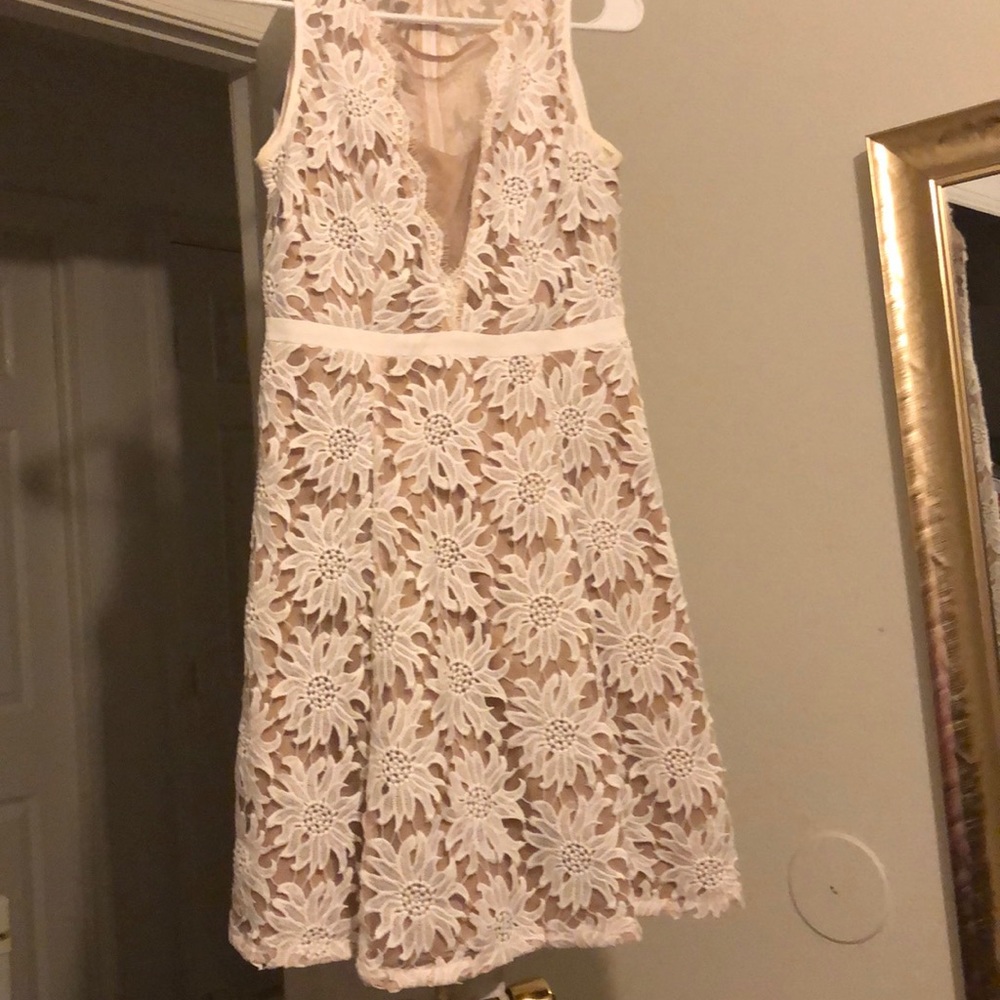 Midi dress features embroidered flowers fabric!